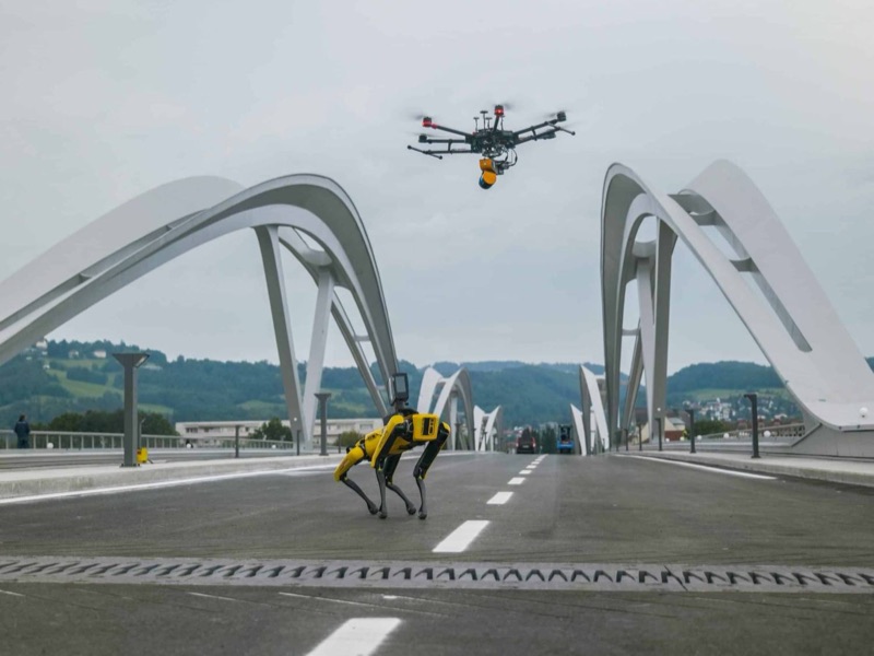 Drone and robot dog Spot capturing a bridge in Linz